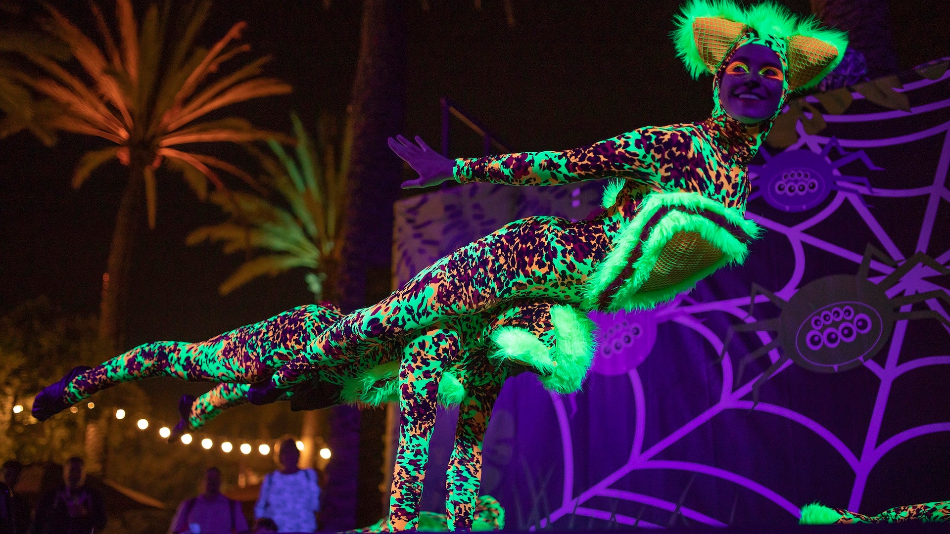a woman wearing a neon animal costume